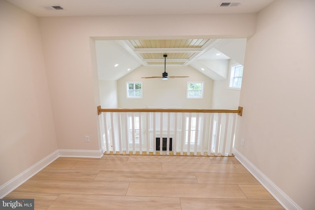 hall featuring light hardwood / wood-style floors, wood ceiling, and vaulted ceiling with beams