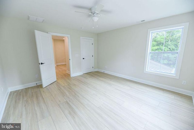 unfurnished bedroom featuring ceiling fan and light hardwood / wood-style floors