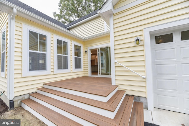 wooden deck with a garage