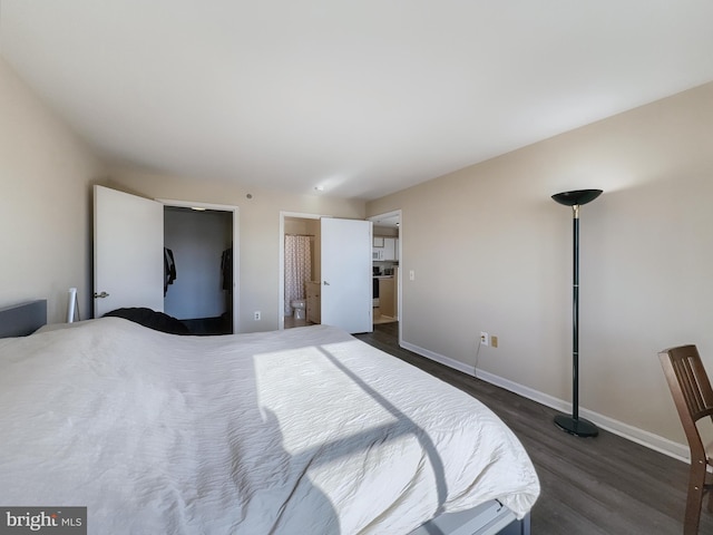 bedroom with dark hardwood / wood-style flooring