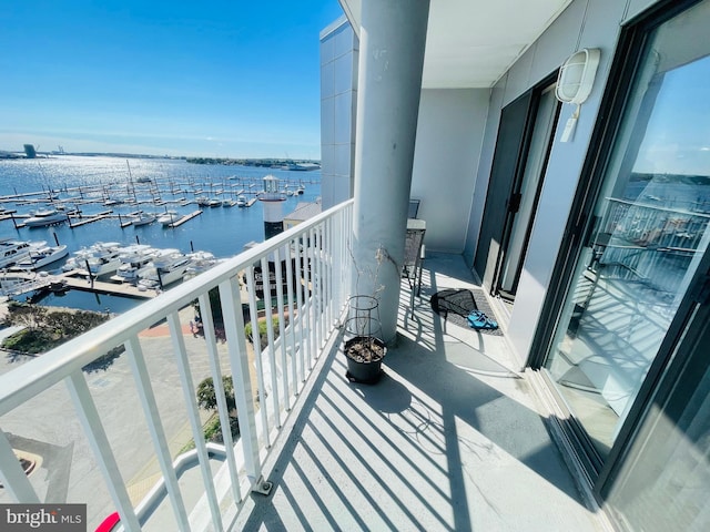 balcony featuring a water view