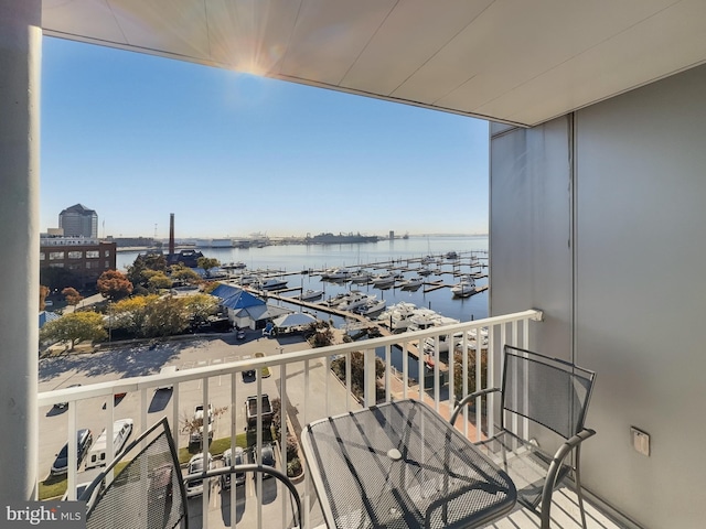 balcony featuring a water view