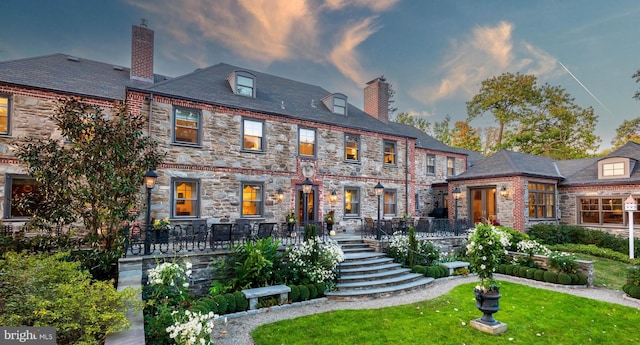 view of front of house with a yard