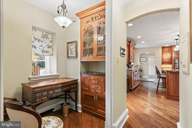 hallway with dark hardwood / wood-style floors