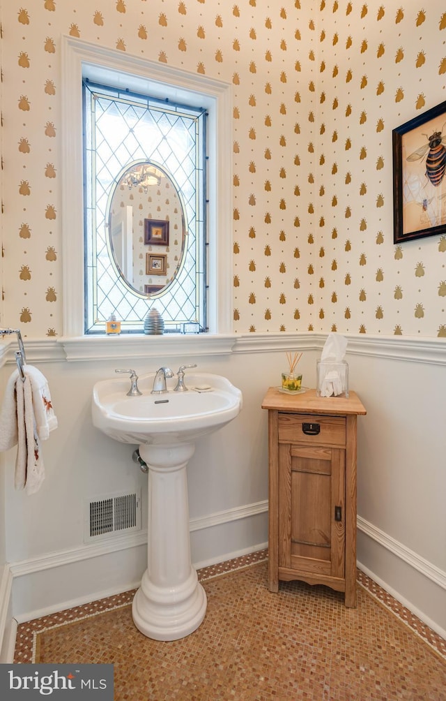 bathroom with tile patterned flooring