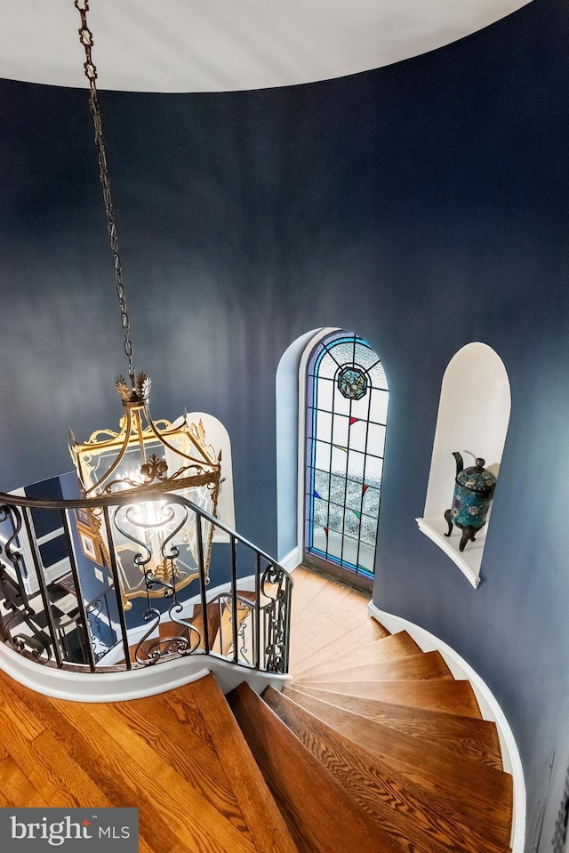 entryway featuring light hardwood / wood-style floors and a chandelier