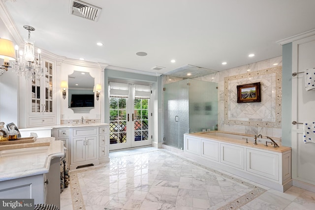 bathroom with french doors, crown molding, vanity, and shower with separate bathtub