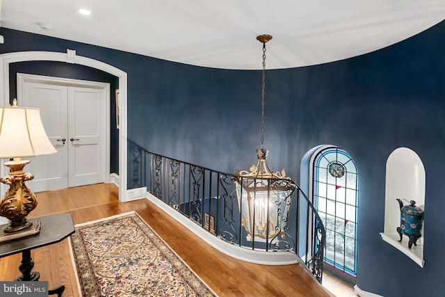 hall with light hardwood / wood-style flooring