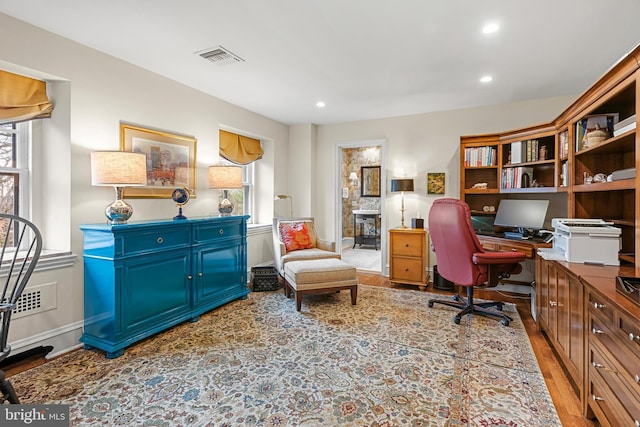 office space with hardwood / wood-style flooring