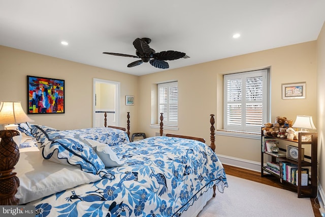 bedroom with hardwood / wood-style flooring and ceiling fan