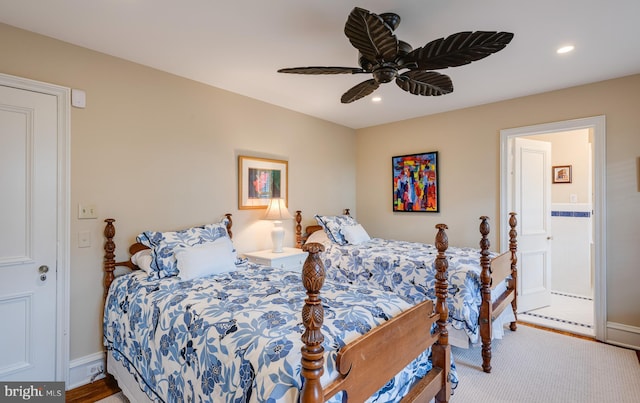 bedroom featuring connected bathroom, carpet floors, and ceiling fan