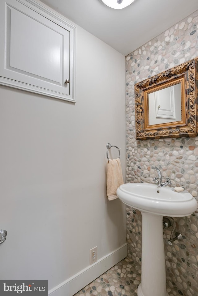 bathroom with tile patterned floors