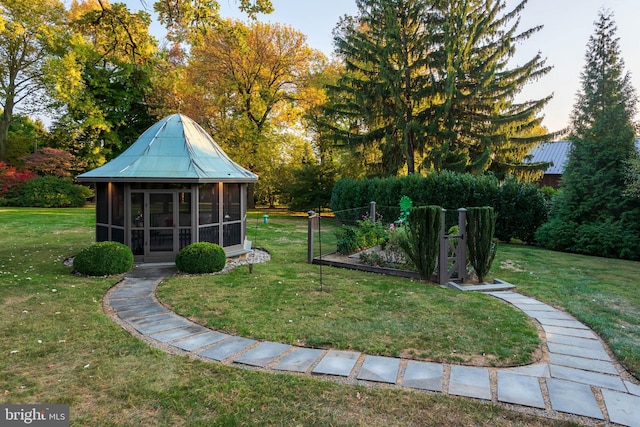 view of yard featuring a sunroom