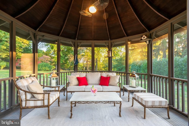 unfurnished sunroom with a healthy amount of sunlight, wooden ceiling, and lofted ceiling