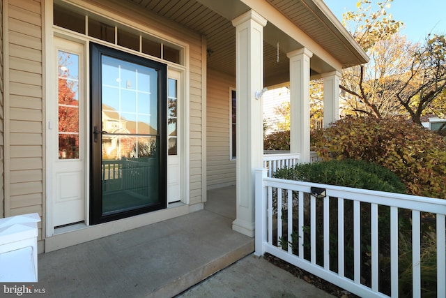 doorway to property with covered porch