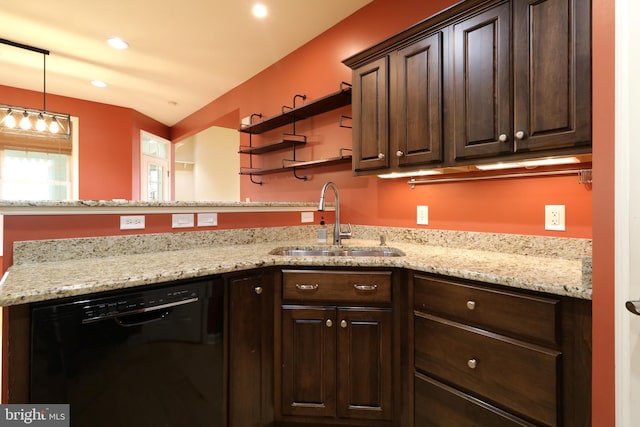 kitchen featuring sink, black dishwasher, light stone counters, decorative light fixtures, and dark brown cabinets