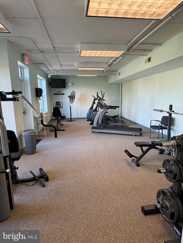 exercise room with carpet floors