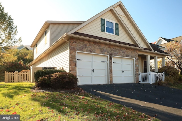 view of side of home featuring a lawn and a garage