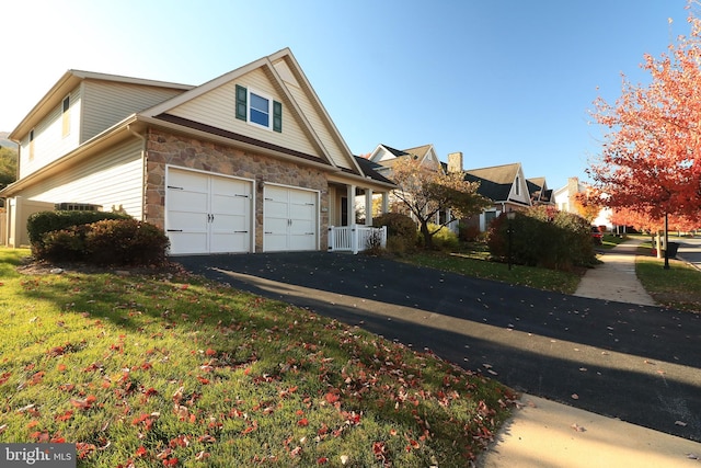 view of side of home with a garage and a lawn