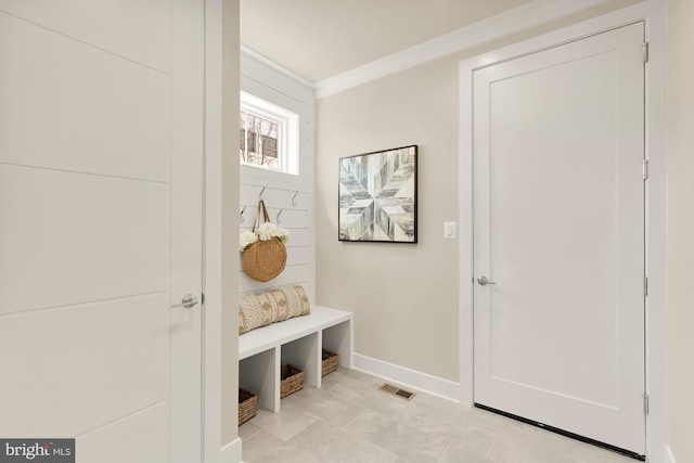 mudroom featuring crown molding