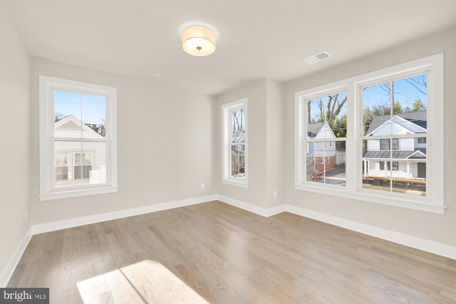 unfurnished room featuring light hardwood / wood-style flooring