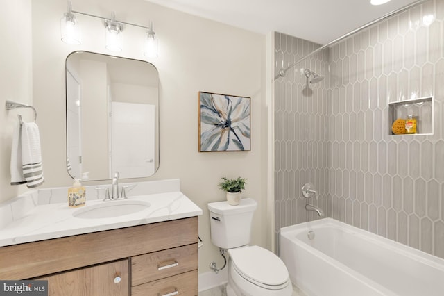 full bathroom with vanity, toilet, and tiled shower / bath