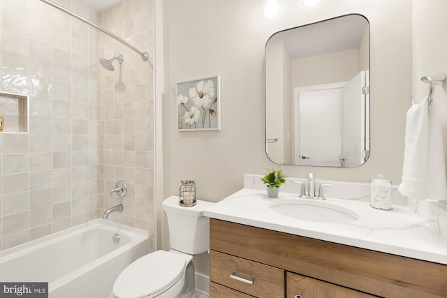 full bathroom with tiled shower / bath combo, vanity, and toilet