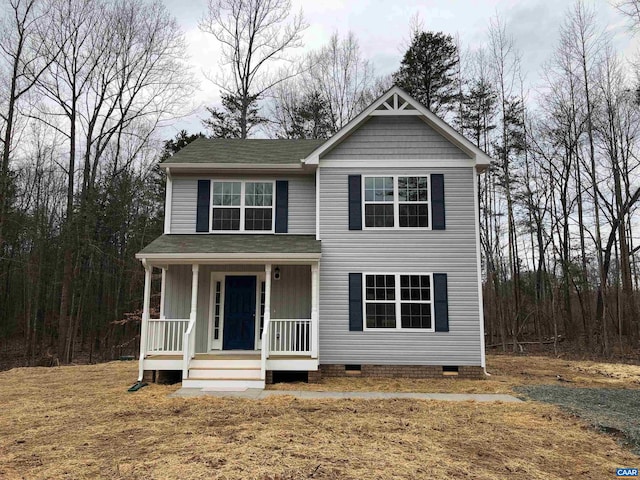 view of front facade with a porch and a front lawn