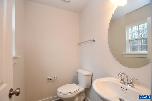 bathroom with sink and toilet