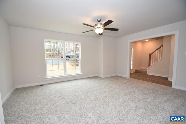 spare room with carpet floors and ceiling fan