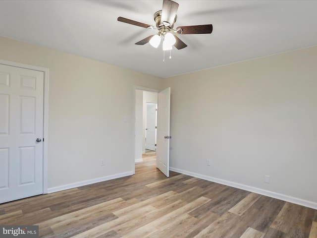 unfurnished bedroom featuring light hardwood / wood-style flooring and ceiling fan