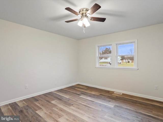 unfurnished room featuring hardwood / wood-style flooring and ceiling fan