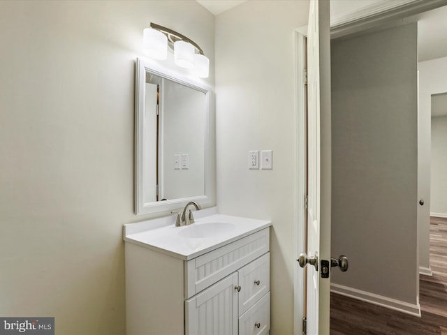 bathroom featuring vanity and hardwood / wood-style flooring