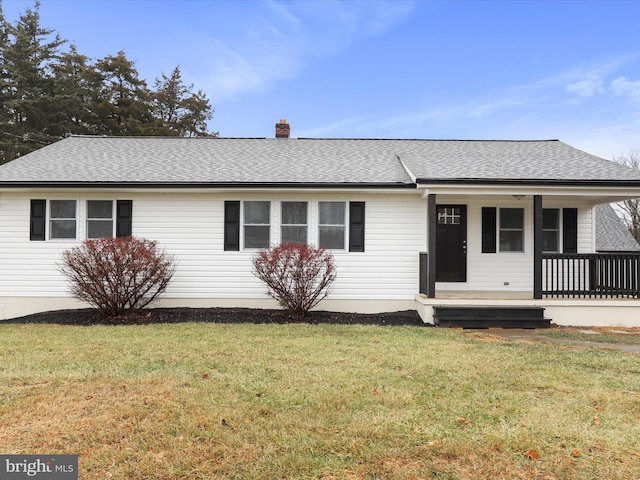 single story home featuring a porch and a front yard