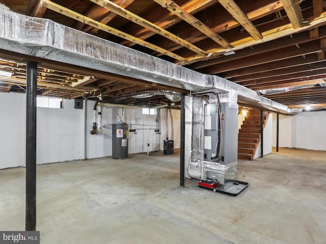 basement with heating unit and electric water heater