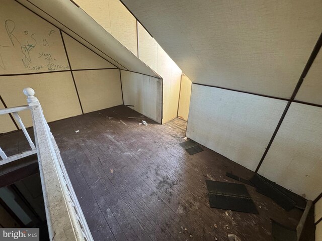 bonus room featuring dark hardwood / wood-style flooring