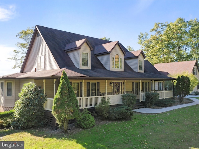 view of front of home featuring a porch and a front lawn