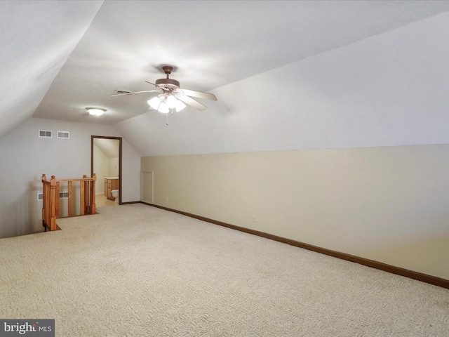 additional living space featuring ceiling fan, carpet flooring, and vaulted ceiling