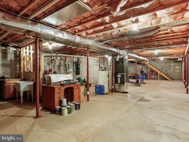 basement with water heater and heating unit