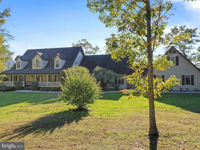 exterior space featuring a porch and a front lawn