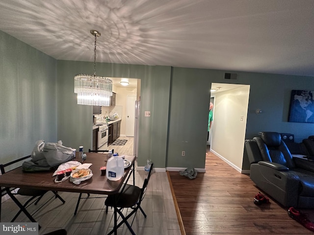 dining area with hardwood / wood-style floors