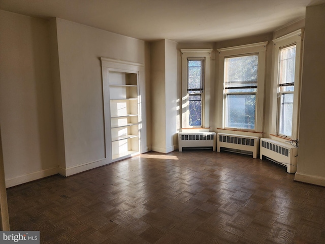 empty room featuring radiator heating unit