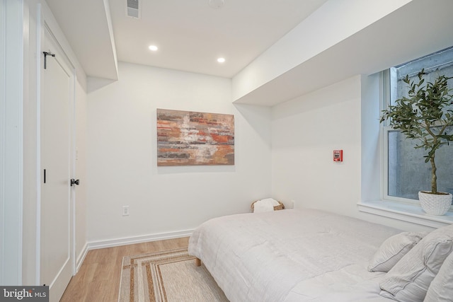 bedroom featuring light wood-type flooring