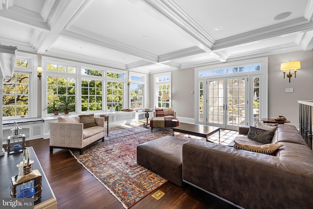 living room with french doors, coffered ceiling, beamed ceiling, ornamental molding, and dark hardwood / wood-style flooring