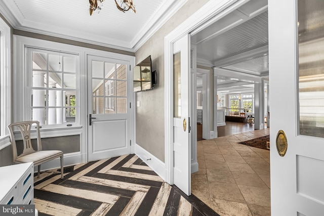 doorway to outside featuring ornamental molding