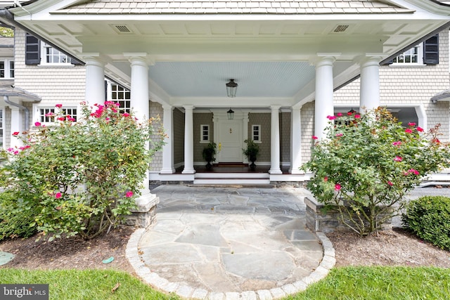 doorway to property with covered porch