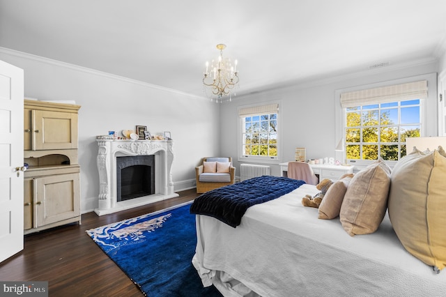 bedroom featuring radiator heating unit, crown molding, dark hardwood / wood-style floors, and a chandelier