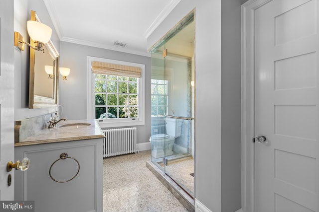 bathroom featuring vanity, ornamental molding, and radiator