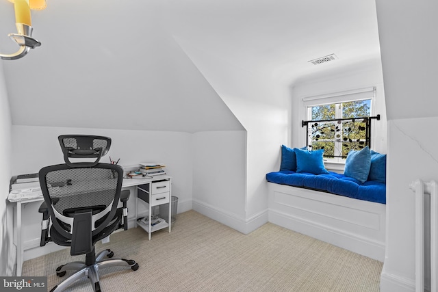 office space featuring carpet floors and vaulted ceiling