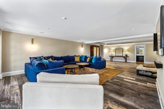 living room featuring ornamental molding and dark wood-type flooring